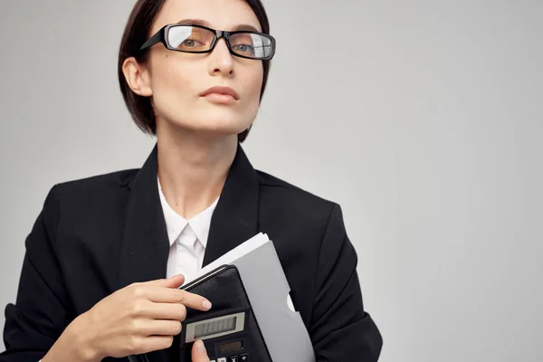 woman in black jacket documents Professional office manager