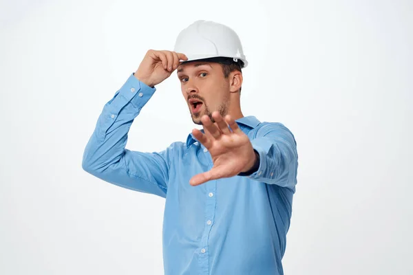 Engineer in a white helmet construction industry isolated background — Stock Photo, Image