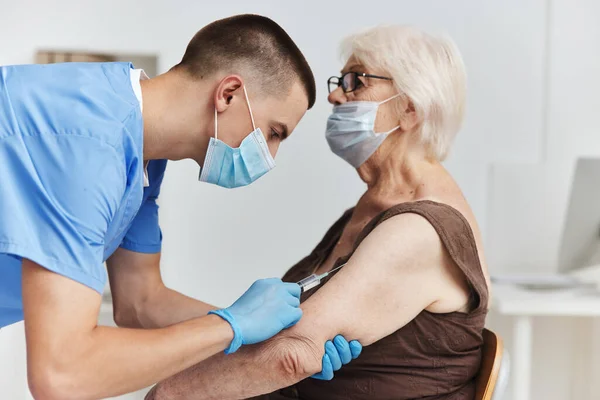 elderly woman in hospital vaccine passport health care