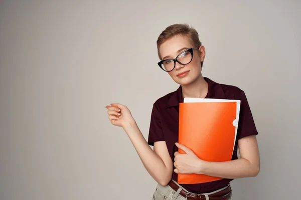 Pretty woman in a red shirt classic style light background — Stock Photo, Image