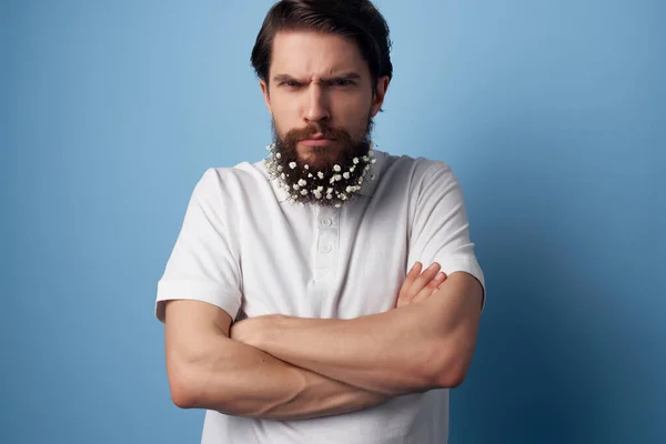 joyful man in shirt flowers in beard decoration nature lifestyle