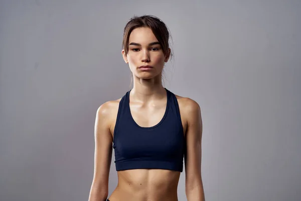 athletic woman boxing punching workout bandages dark background