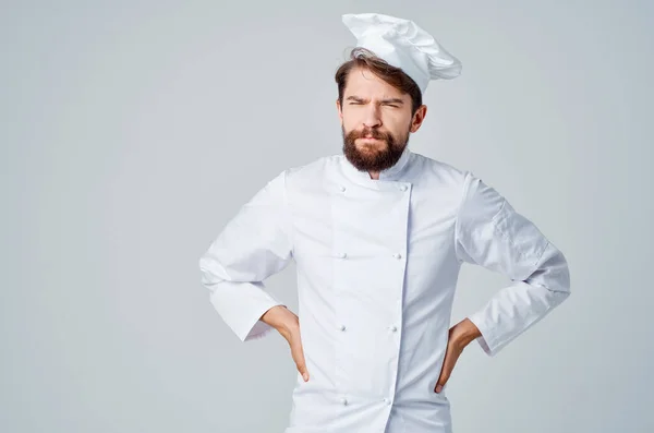 bearded man work uniform profession kitchen light background