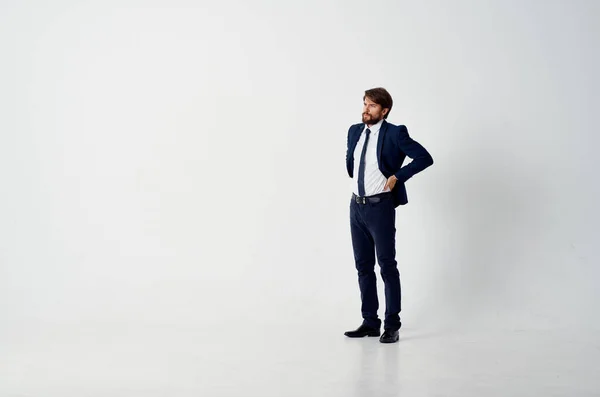 The man in a suit movement Jump light background — Stock Photo, Image