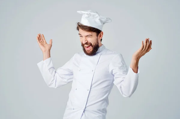 Samec kuchař kuchyně práce ruka gesta světlo pozadí — Stock fotografie