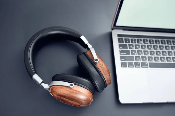 headphones on the table laptop technology