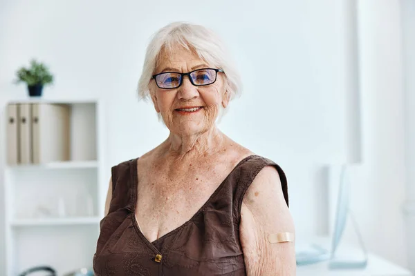 elderly woman in hospital vaccine passport immunity protection