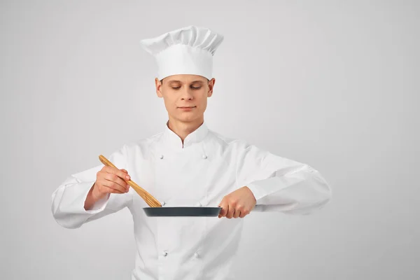 Kock satsning med skägg i handen köksredskap restaurang professionell — Stockfoto