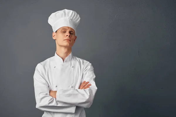 chef with a cap on his head gesturing with his hands work profession