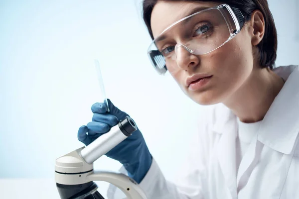 woman laboratory assistant microscope diagnostics research professionals science