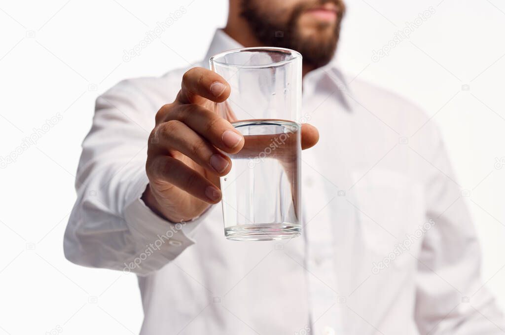 man in white shirt drinking water isolated background