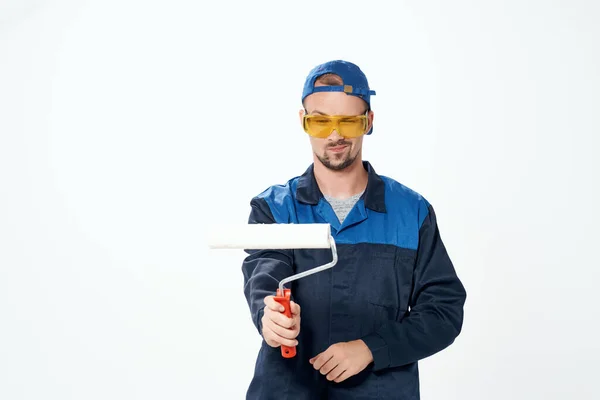 Man in working uniform repair painting decorator — Stock Photo, Image