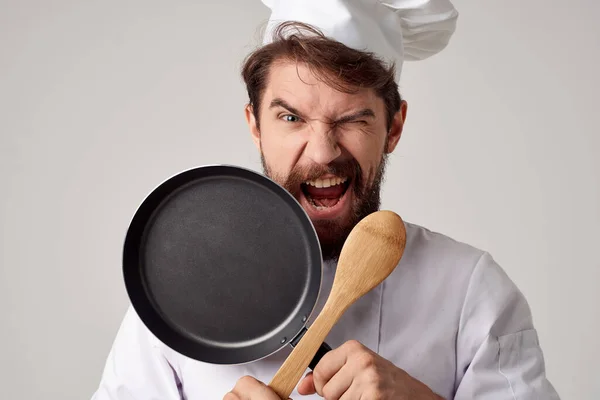 male chef in restaurant cooking food service work