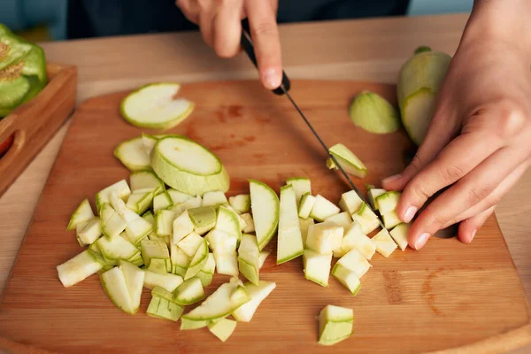 cutting vegetables on a cutting board kitchen cooking