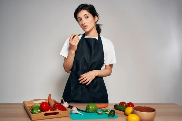 woman chef in black apron vegetables healthy food vitamins