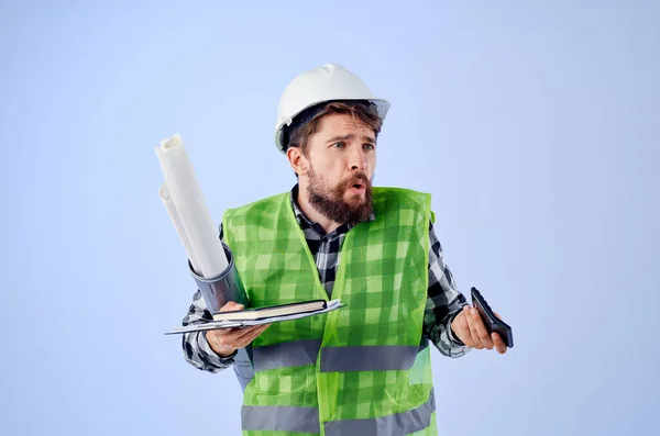 Male worker in a white helmet blueprints Professional studio industry — Stock Photo, Image