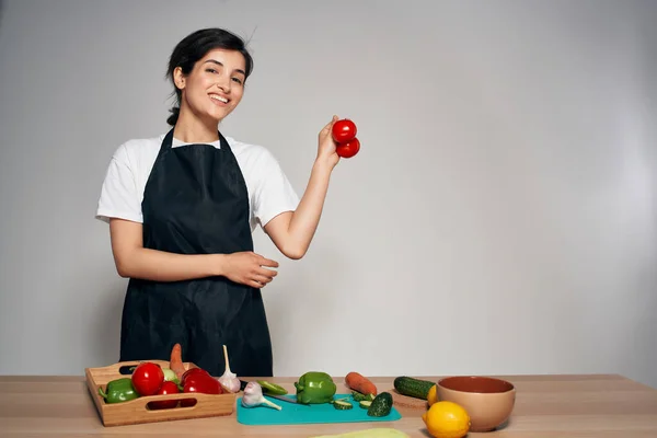 woman chef in black apron vegetables healthy food vitamins