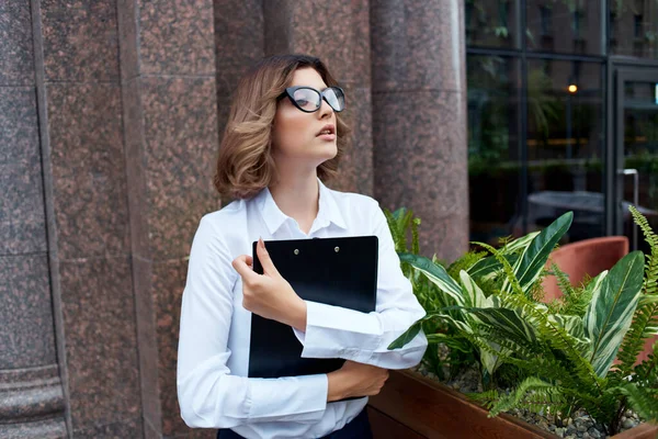 woman in suit outside official job success work light background