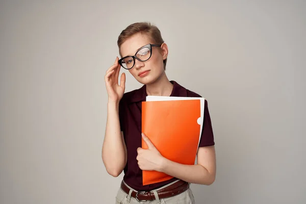 Female student in a red shirt classic style isolated background — Stock Photo, Image