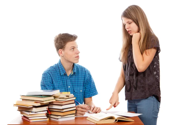 Sister teaching her brother Royalty Free Stock Photos