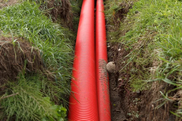 Red cable pipes — Stock Photo, Image