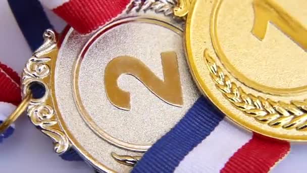 Top view of winner or champion gold silver bronze trophy medal rotating on white background. Victory first place of competition. Winning or success concept. — 图库视频影像