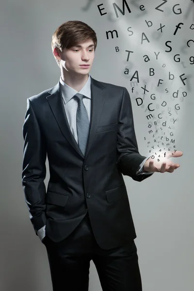 Young business man with alphabet letter — Stock Photo, Image