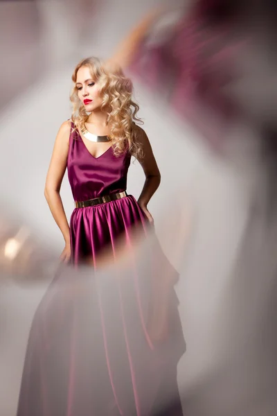 Beautiful woman model posing in elegant dress — Stock Photo, Image