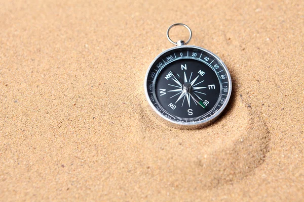 Compass on the sea sand — Stock Photo, Image