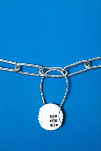 Cipher padlock on chain on blue background. Security concept. — Stock Photo, Image