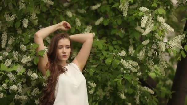 Woman Long Wavy Hair Relaxes Next Blooming Bird Cherry Spring — Stock Video