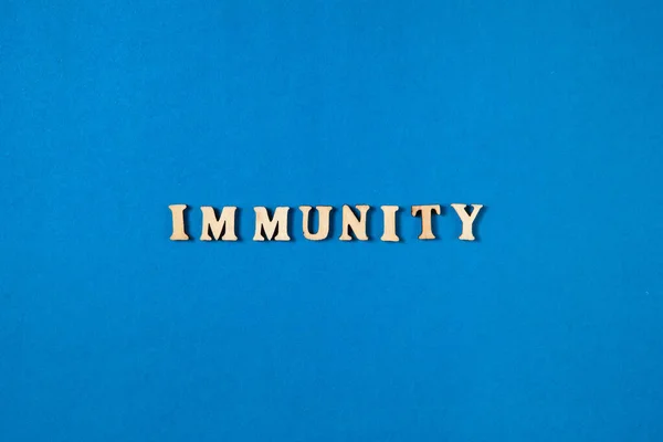 Word Immunity Wooden Letters Blue Background Flat Lay Design — Stock Photo, Image