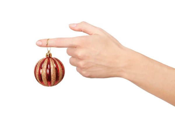 Ženská ruka držící vánoční kouli — Stock fotografie
