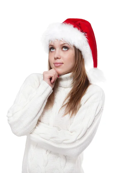 Nachdenkliche Frau mit Weihnachtsmütze auf weißem Hintergrund — Stockfoto