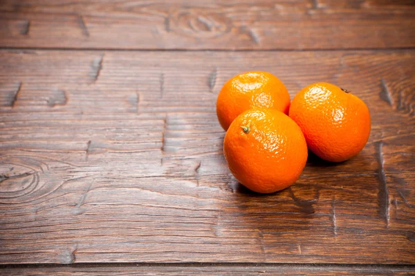 Tangerines on wooden table — Stock Photo, Image