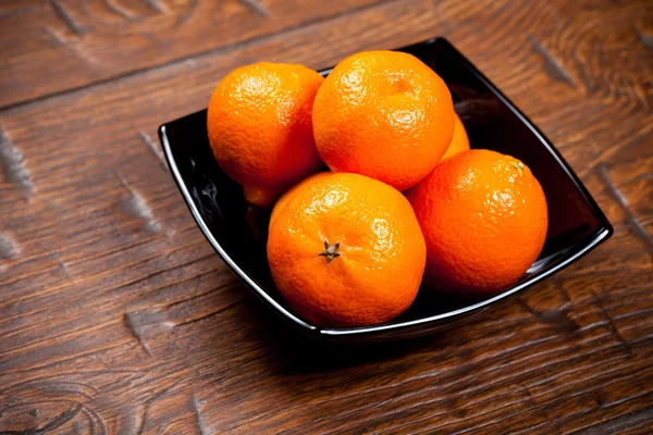 Tangerines on wooden table — Stock Photo, Image