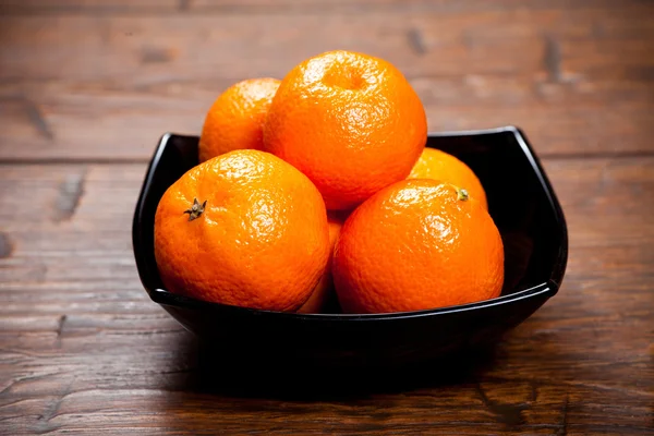 Tangerines on wooden table — Stock Photo, Image