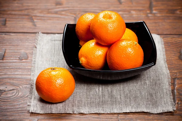 Tangerines on wooden table — Stock Photo, Image