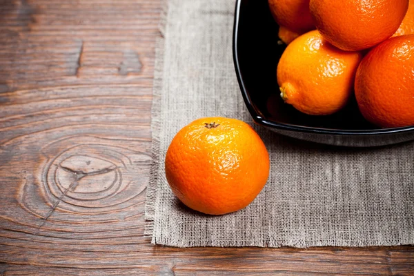 Tangerines on wooden table — Stock Photo, Image