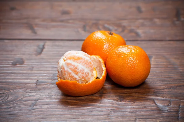 Tangerines on wooden table — Stock Photo, Image