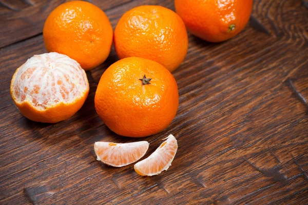 Tangerines on wooden table — Stock Photo, Image