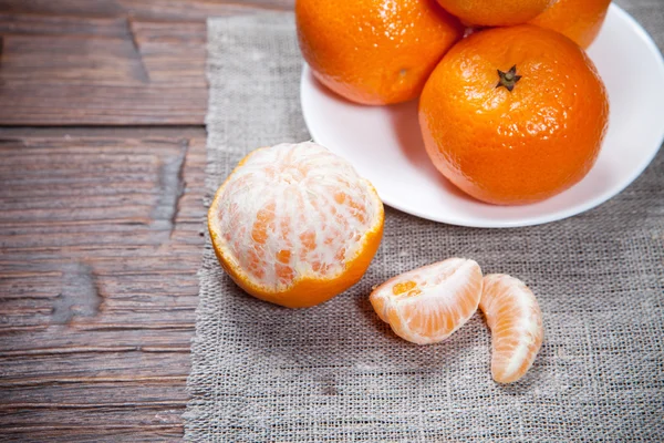 Tangerines on wooden table — Stock Photo, Image