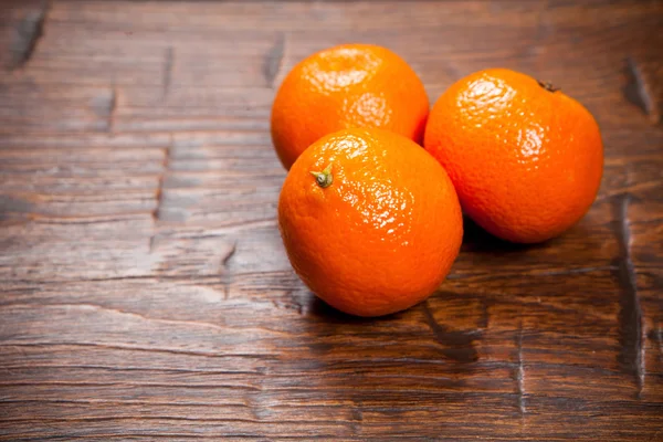 Tangerines on wooden table — Stock Photo, Image