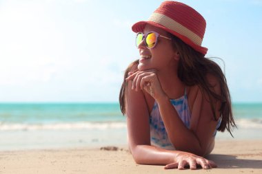 Beautiful woman enjoying evening at the seaside