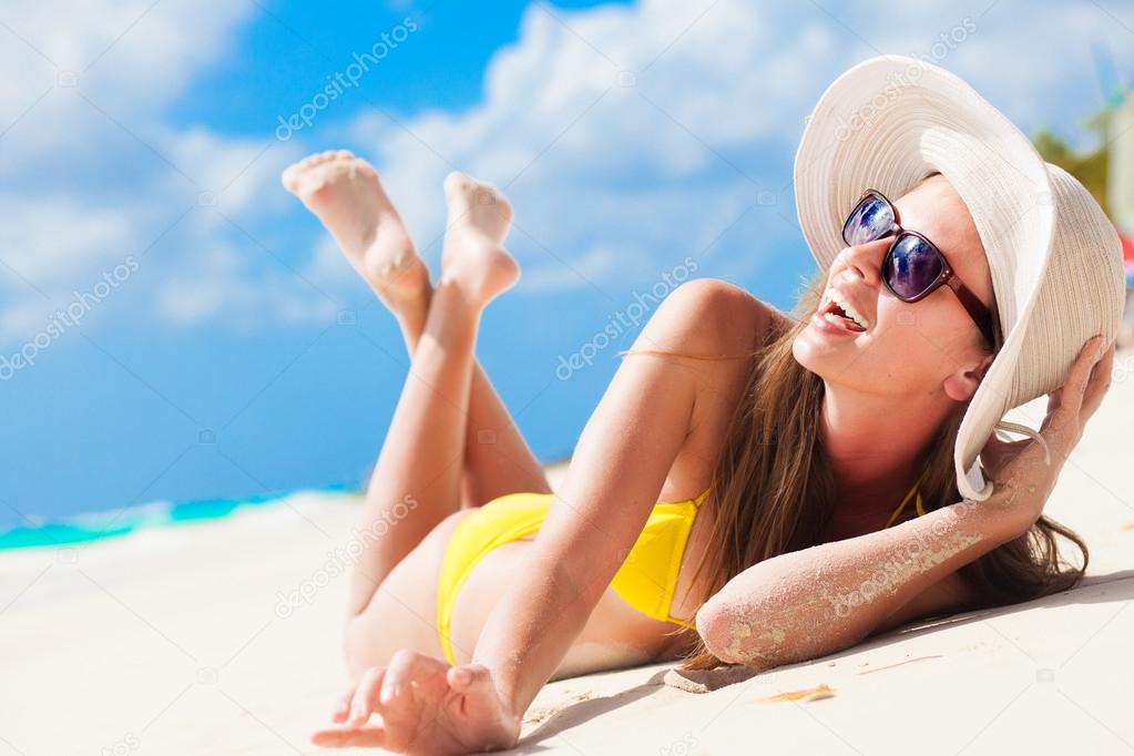 long haired girl in bikini having fun on tropical barbados beach 