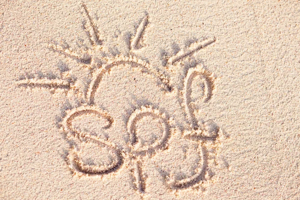 SPF escrito à mão na areia em uma praia de Barbados — Fotografia de Stock