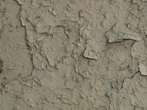 Peinture fissurée grise sur un vieux mur — Photo