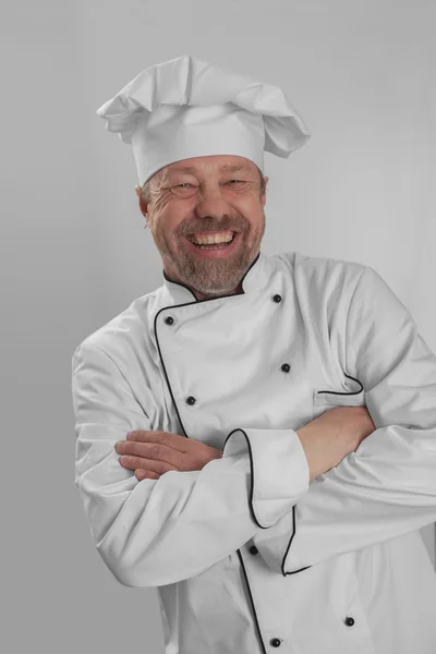 Cocinar en la gorra blanca se ríe —  Fotos de Stock