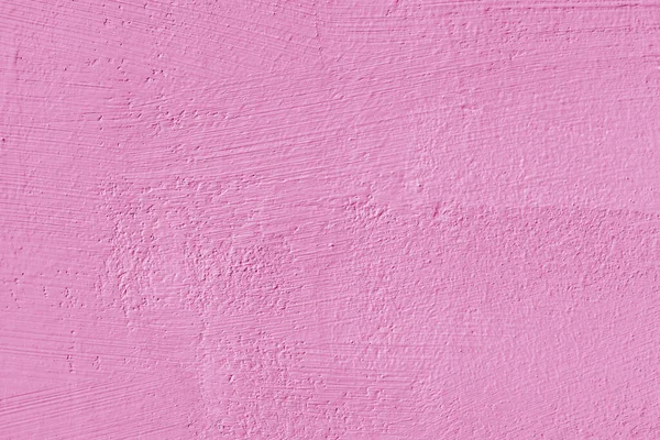 Texture of pink plaster. Interior of a modern loft. Abstract rough background. The facade of an old house.