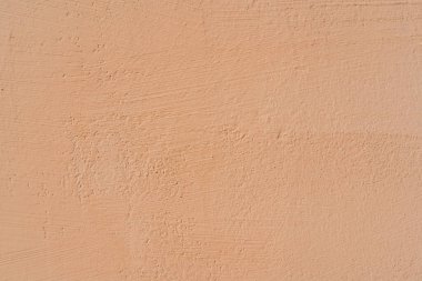 Bej alçı dokusu. Modern bir çatı katının içinde. Soyut kaba bir arkaplan. Eski bir evin cephesi.